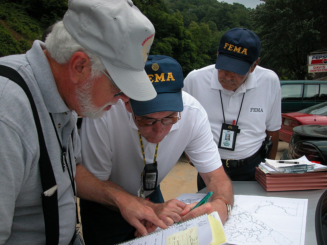 State and federal inspectors reviewing flood damage to homes in Raven, Virginia